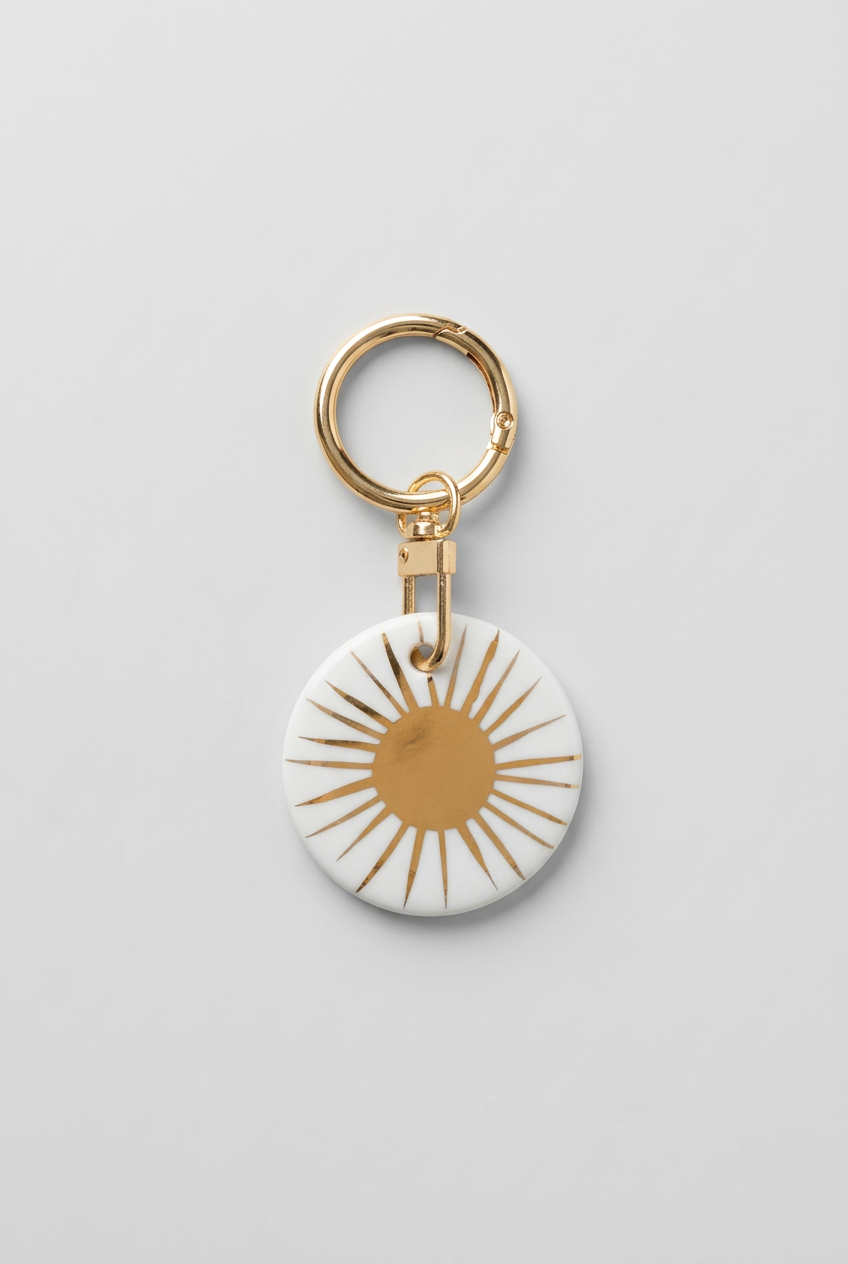 Médaillon de collection en porcelaine Soleil Blanc (5 cm)